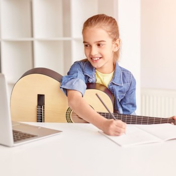 Virtual Music Lessons | Girl Learning Guitar on Computer